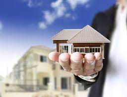 man holding on miniature house - By What You Can Choose the Best Real Estate Solutions